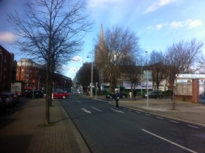 From New Street looking towards the awkward intersection known as the Four Corners of Hell. The steeple of St. Patrick's Cathedral rises in the background.